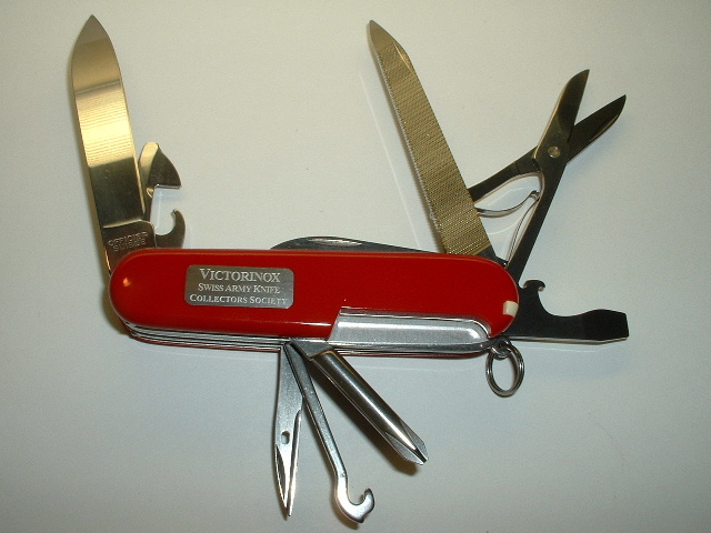 This is the Victorinox Swiss Army Knives Collectors Society (VSAKCS) 2006 club knife. 
It is a custom model called an 'Astronaut', which has an inlaid metal space shuttle on the front scale, and on the reverse a plate engraved with the VSAKCS words spelt out. 
This model is not to be confused with the older 1980's Space Shuttle or Astronaut models, which were completely different, regular, Victorinox releases.